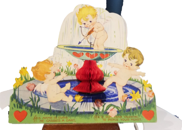 Valentine card three cupids in a fountain with crepe paper