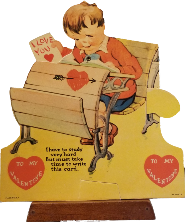 Mechanical Valentine card featuring boy at desk with Valentine in hand