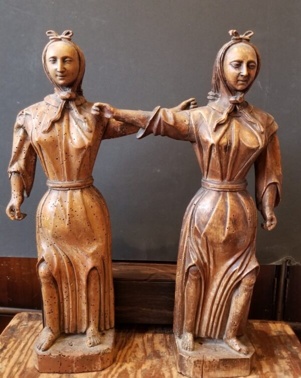 Antique wormwood carved wooden statues of women with braided hair