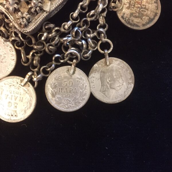 Tribal Ottoman belt buckle closeup of coins