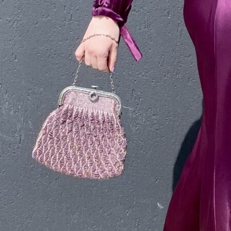woman's hand holding evening bag