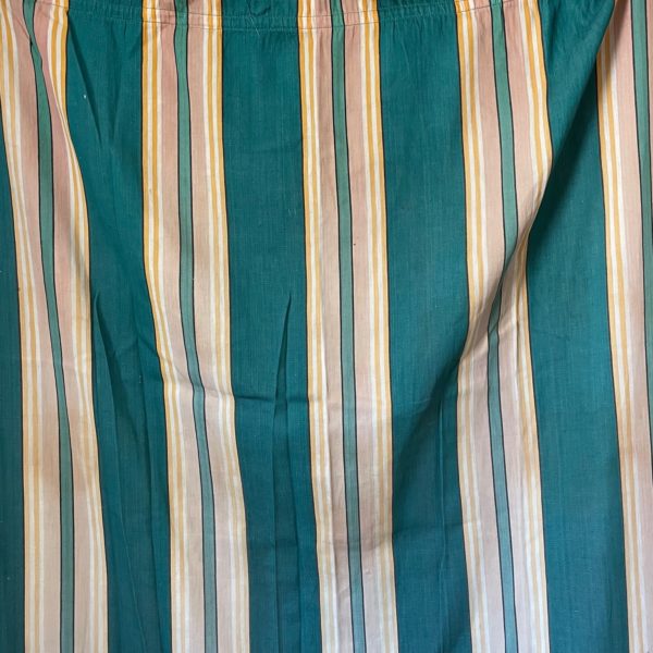 Single striped vintage curtain panel. Some staining and damage. Metal rings at the top.