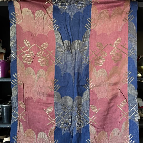 Jacquard woven curtain panel in dark blue, burgundy and gold. Approximate size 21” wide and 68” long. One piece only. $60.